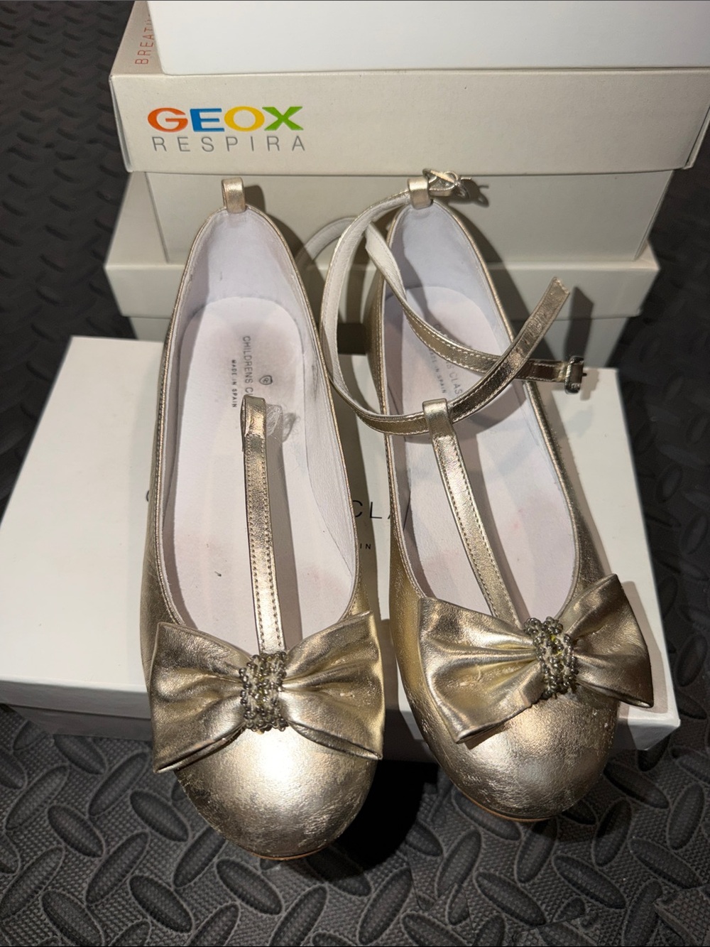 Geox Gold T‑Strap Bow Flats with Jeweled Accent